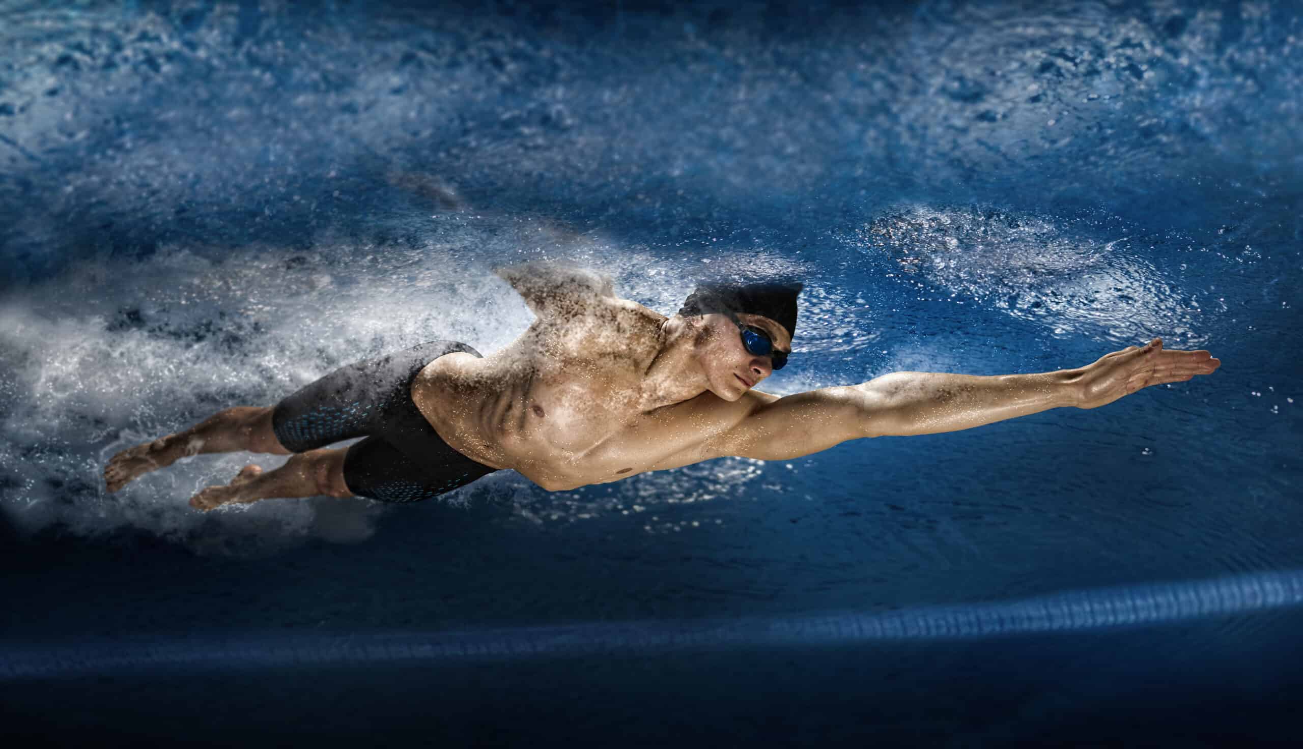Man in swimming pool. View underwater